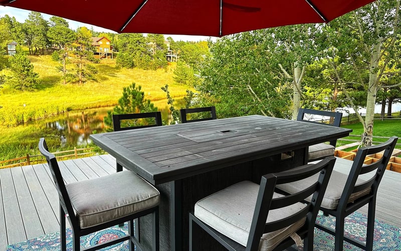 Patio dining with meadow views — Evergreen Mountain House