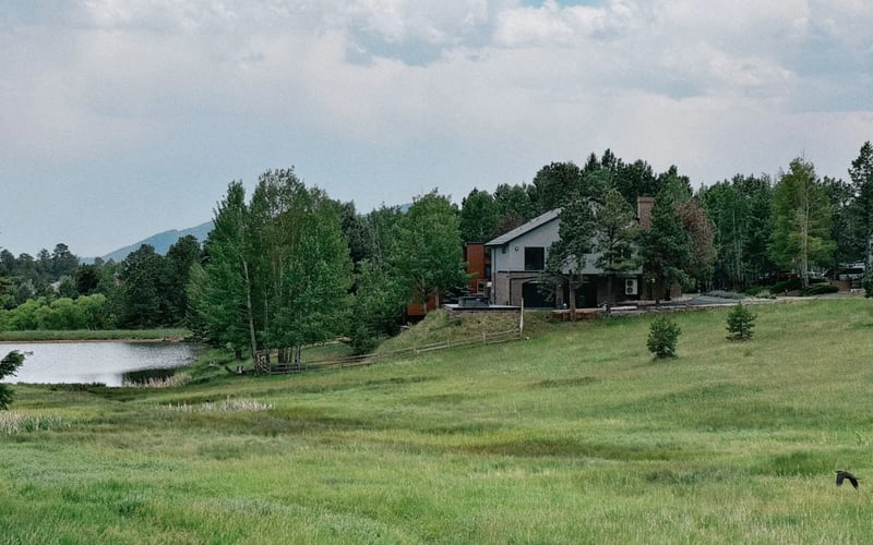 The house above the pond — Evergreen Mountain House