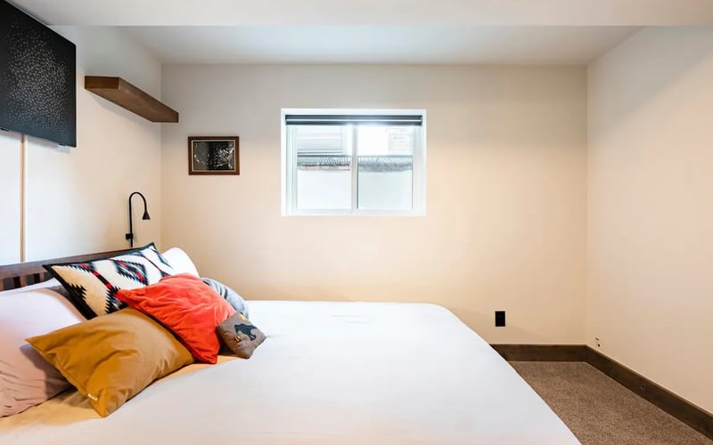 Garden-level bedroom — Evergreen Mountain House